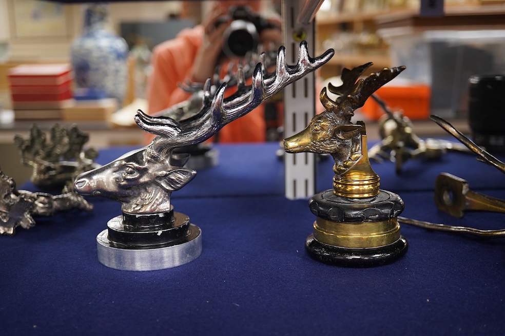 Five chrome and brass car radiator mascots; three in the form of stags’ heads, a stag standing on an oak branch and an Art Deco leading gazelle. Condition - fair, some losses to chrome plating.